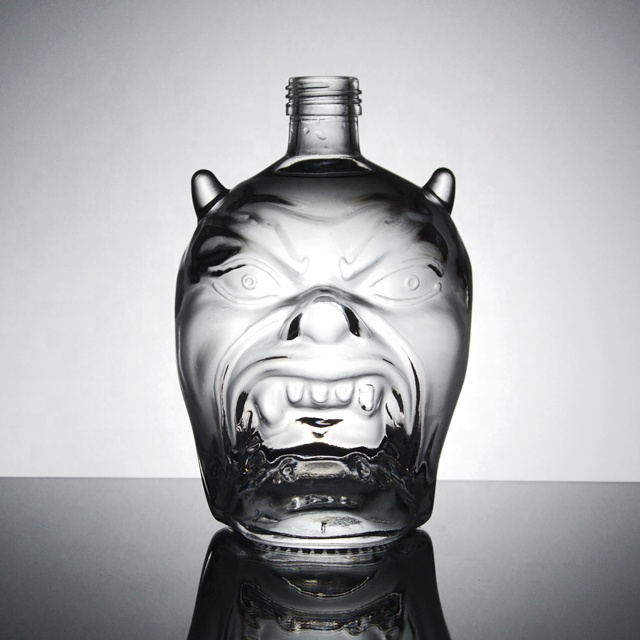 customized unique shape embossed glass liquor bottles