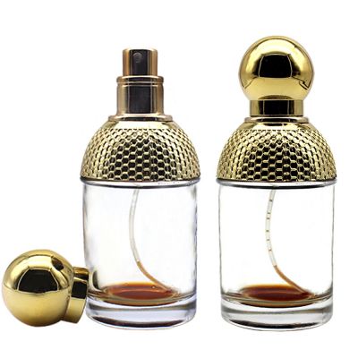 100 ml wholesale empty custom round woman perfume glass bottles with pump for sale