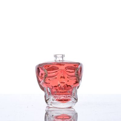 2019 style 100ml skull shape perfume glass bottle with sprayer cap 