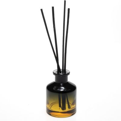 OEM ODM brand black yellow round aroma oil glass bottle 50ml glass bottle diffuser with cork 