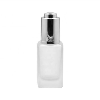 1oz square frosted glass lotion bottle with button pressed pump 