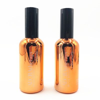 Wholesale Printing and packaging OEM 100ml orange pump sprayer Glass bottle for essential oil