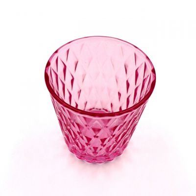 Diamond shaped translucent red cone candle glass jar