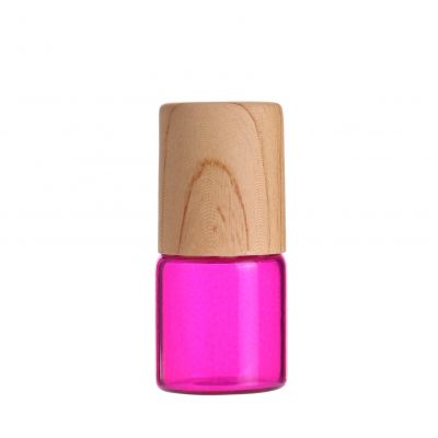 High quality 2ml pink essential oil perfume glass roll on bottle with steel roller ball and wood grain plastic cap