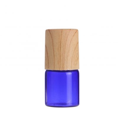 Super September small 2ml blue perfume eye cream skincare glass roller bottle with steel roller ball and wood grain plastic cap