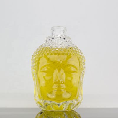 Custom Embossed Design Unique Buddha Head Shape 700ml Glass Liquor Bottle For Corks 