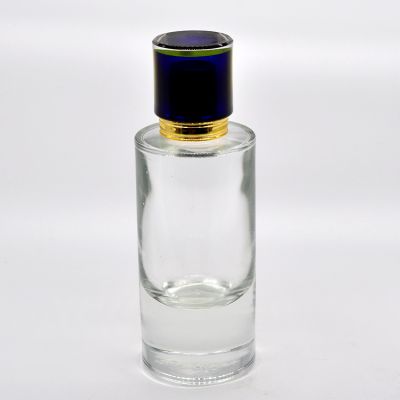 High quality cylindrical 100ml high quality glass platform perfume bottle with blue cover 