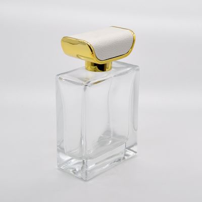 Custom 100 ml transparent glass perfume bottle with retro leather cap