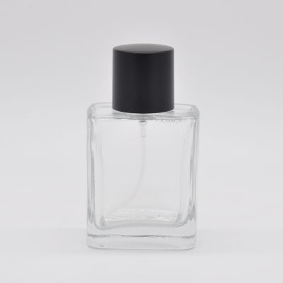 Empty 50ml transparent glass perfume bottle with pump sprayer in stock black cap 