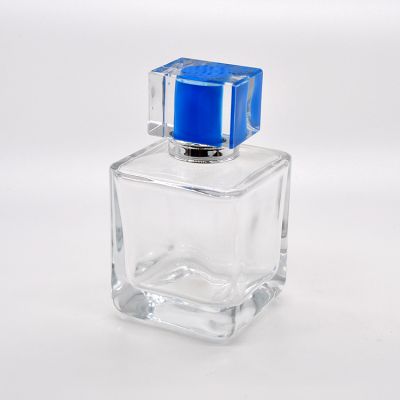 Wholesale square 100ml transparent glass perfume bottle with blue hat 
