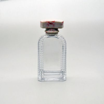 100ml empty high quality OEM designed customized transparent glass perfume bottle with stripes with pump sprayer 