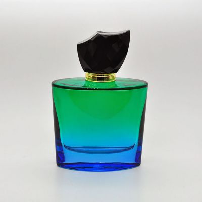 100ml empty high quality OEM customized design green glass perfume bottle with black cap 
