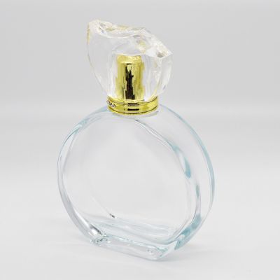 Wholesale Round ladies delicate empty 100ml transparent glass perfume bottle