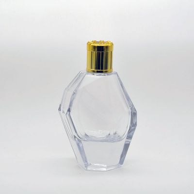 100ml empty high quality OEM customized transparent glass perfume bottle with gold cap with pump sprayer 