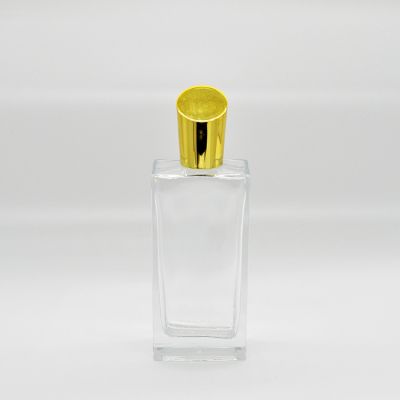 Simple stylish 100ml gold cover rectangular glass perfume bottle 