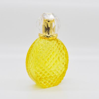 Beautiful design 60ml round yellow pineapple road glass perfume spray bottle with pump 