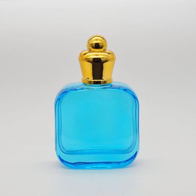 100ml empty high quality OEM customized design blue glass perfume bottle with gold cap 