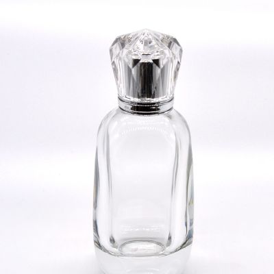 Unique design 100ml clear empty round shaped crystal glass perfume bottle 