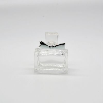 Wholesale Fancy design bulk glass perfume bottle with beautiful cap 