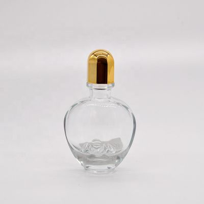 25ml Empty high quality special shape transparent OEM glass perfume bottle with pump sprayer gold cap 