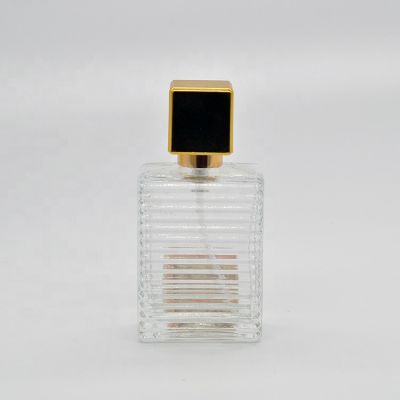 25ml Empty high quality rectangular shape transparent OEM glass perfume bottle with pump sprayer gold cap 