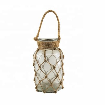 China circle clear glass candle holder can be used in restaurant and the candle holder has a hemp rope handle