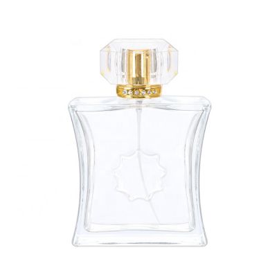 Luxury empty 100ml special shape clear crystal perfume glass bottle with gold aluminum sprayer acrylic cap