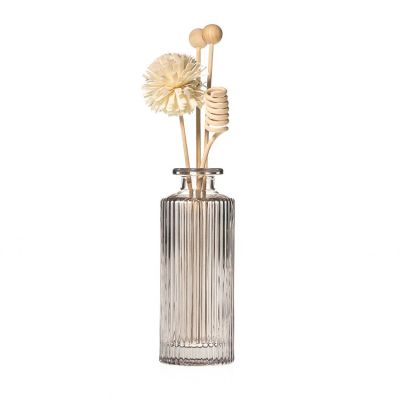 Factory Outlet Embossed Cylindrical Shaped 150ml Reed Diffuser Glass Bottle With Wooden Ball