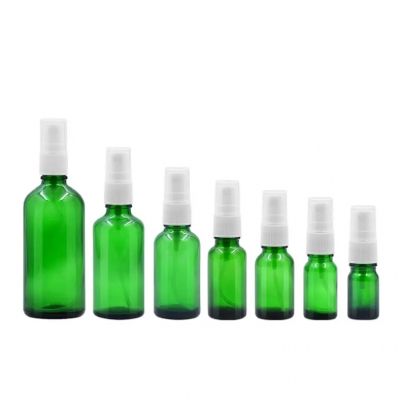 Wholesale customized amber green Essential oil glass bottles with sprayer screw head