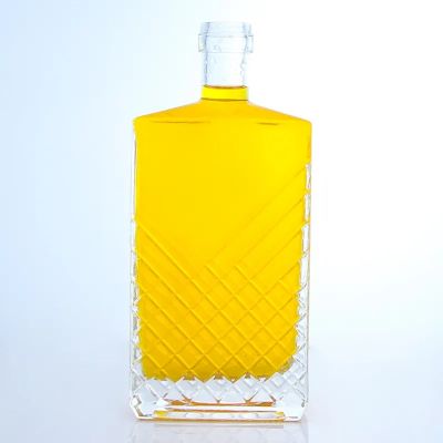 Hot sale custom carved 700ml 750ml whisky bottle vodka glass bottle with cork cap
