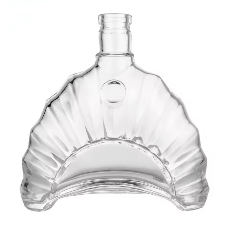 Wholesale 700ml Seashell Shape Ocean Wave Sculptured Glass Bottle for Brandy Tequila Custom Design Empty Spirit Liquor Bottle