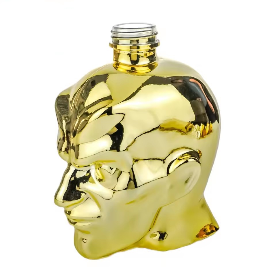 Wholesale 750ml Custom Electroplated Gold Face Shape Liquor Bottle for Whiskey Tequila Vodka Empty Novelty Spirit Glass Bottle