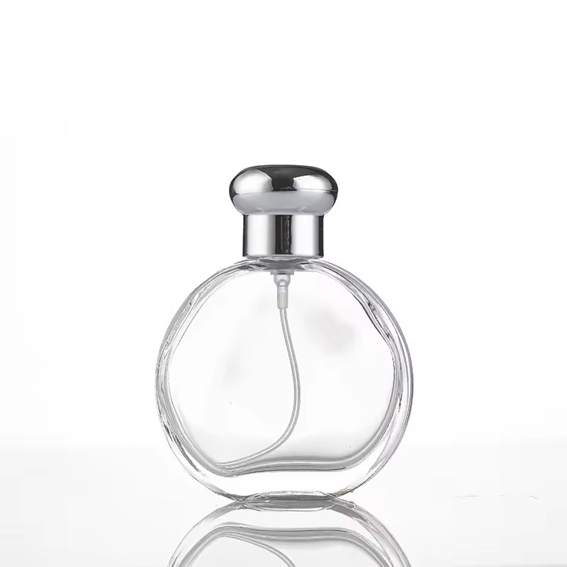 Luxury Flat Shape 50ml 100ml Stock Goods Clear Transparent Premium Glass Perfume Bottle With Sprayer Pump