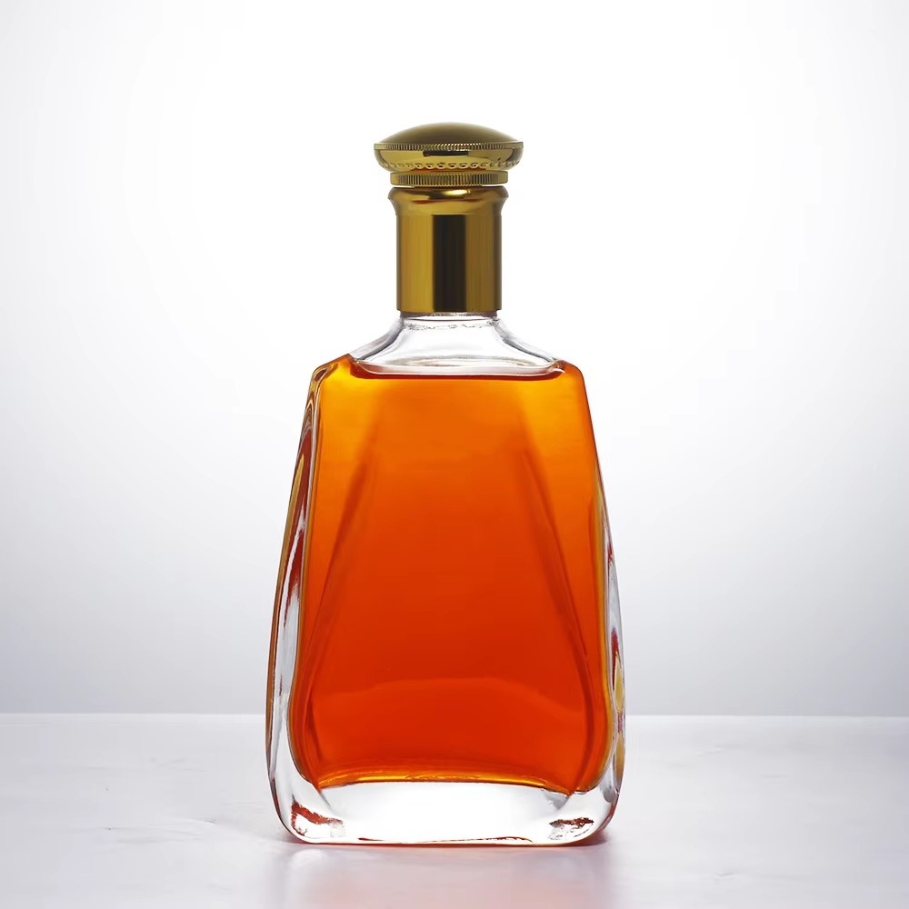 Manufacturer Direct Sales and Environmentally Friendly Tequila Energy Drink Customized Crown Cap Flat Glass Liquid Bottle 700ml