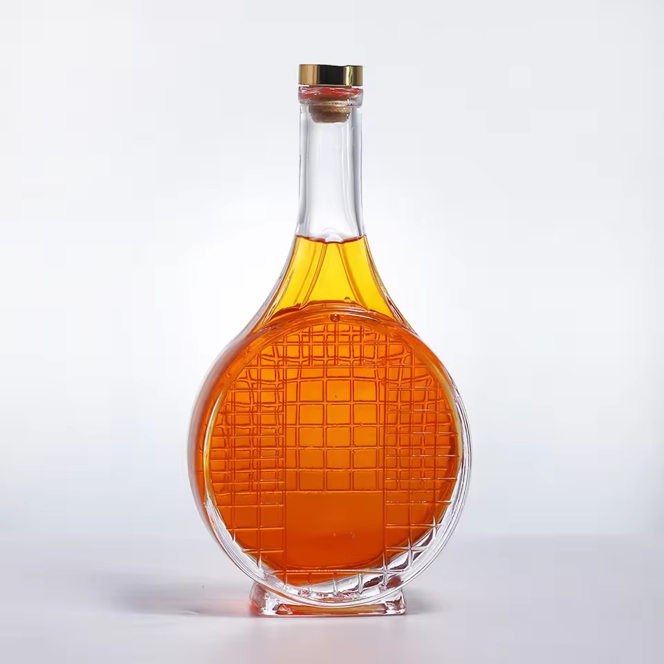 High Quality 700ml Security Luxury Airtight Tennis Shape Glass Bottles with Cork Lids Unique for Tequila and Brandy Branding