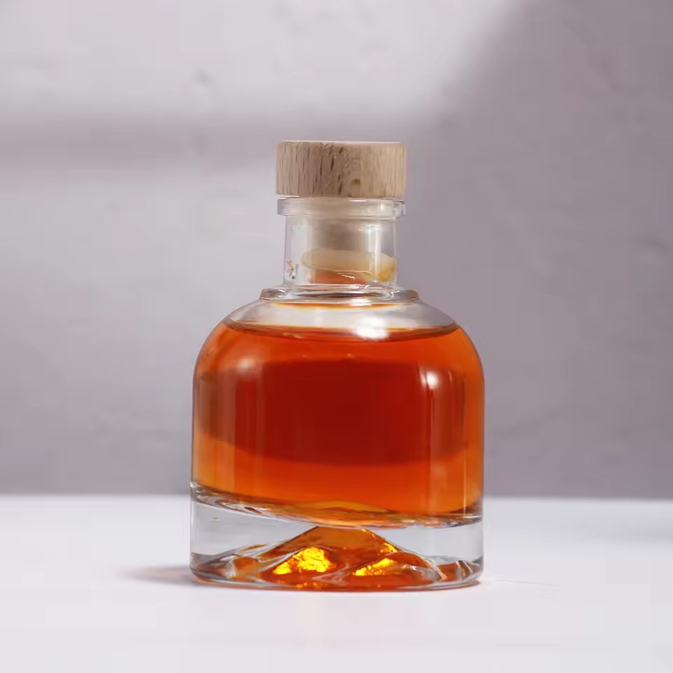 Wholesale 100ml Clear Transparent Customizable Glass Cylinder Drink Bottle Crown Cap Seal for Vodka Whiskey Wine Juice Tequila