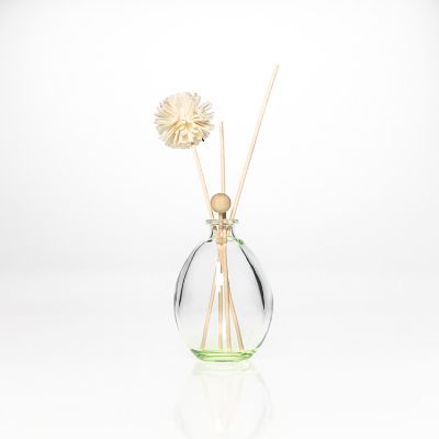 Supplier 6oz Oval Shape Light Green Diffuser Bottle Crystal Glass Air Fragrance Diffuser Bottles with Cork 