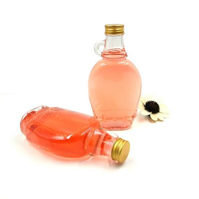 Empty 250 ml clear glass handle maple syrup bottles