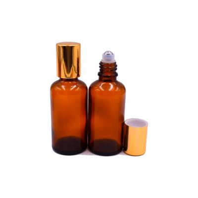 hot sale stocks empty amber 50ml deodorant glass roll on bottle with stainless roller, gold cap 