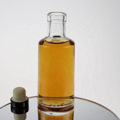 Empty small size round 200ml glass vodka bottle with cork 