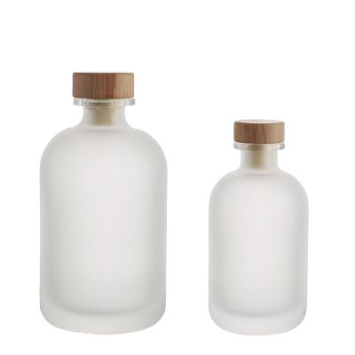 Wholesale 250ml 500ml round shape empty frosted juice wine liquor vodka glass bottles with cork 