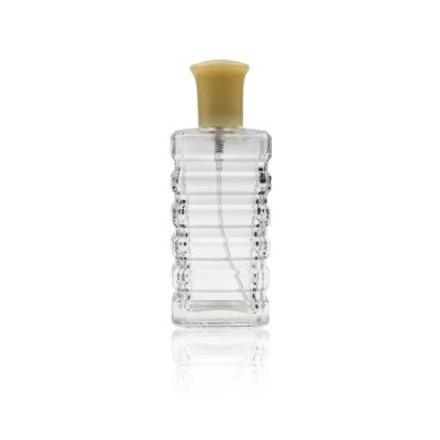 Stylish Rectangle Transparent Perfume Bottle With Beautifully Carved Pattern And Yellow Cap 85 ml For Women 