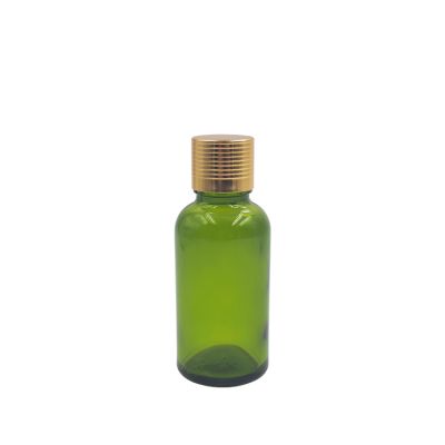 cosmetic packaging containers 2oz glass bottle green 30ml 50ml essential oil bottle cosmetic bottle cap with gold aluminium cap