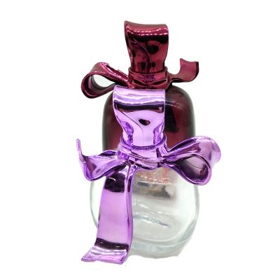 High quality 50 ml 100 ml empty woman perfume frosted glass bottle with bow cover 