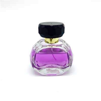 Wholesale 80ml portable round empty glass perfume bottle with sprayer and customizable lid 