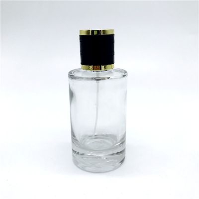 Glass bottle cosmetic 100ml cylinder personalized perfume bottle with easy crimp pump 