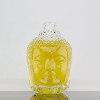 Custom Embossed Design Unique Buddha Head Shape 700ml Glass Liquor Bottle For Corks 