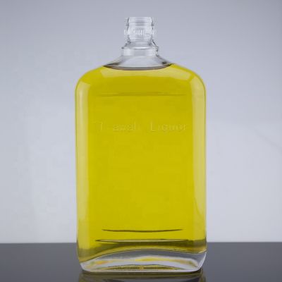 Customized Design Delicate Embossed Glass Liquor Bottle With Cork Sealed 