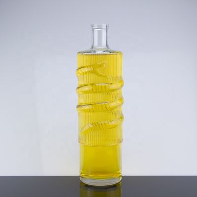 Customized 750ml Cork Sealed Brandy Clear Glass Bottles With Snake Shape Embossed 