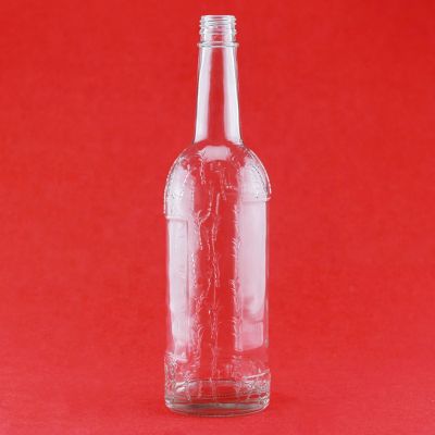 Factory Sell Good Quality Custom Embossed High Flint 750ml Liquor Glass Bottle With Screw Caps 